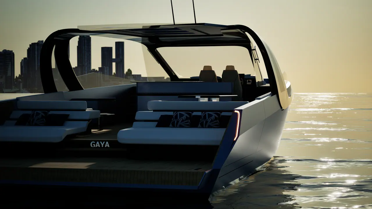Gaya 58 stern at sunset with a city skyline behind
