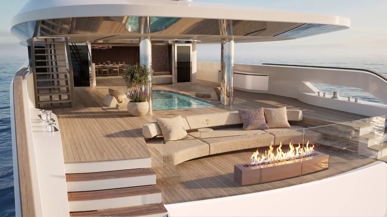 Velado aft deck lounge with fire table and pool at sunset