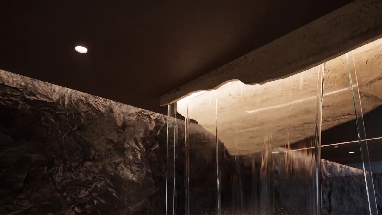 Travertine waterfall over a rock wall in the Velado wellness area